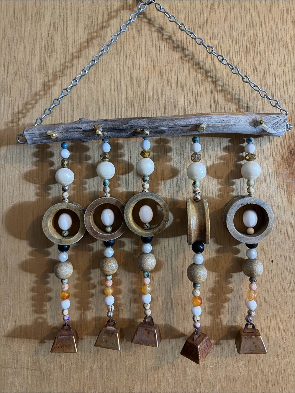 Beaded Driftwood Wall Hanging with Gold Accents outside wind chimes